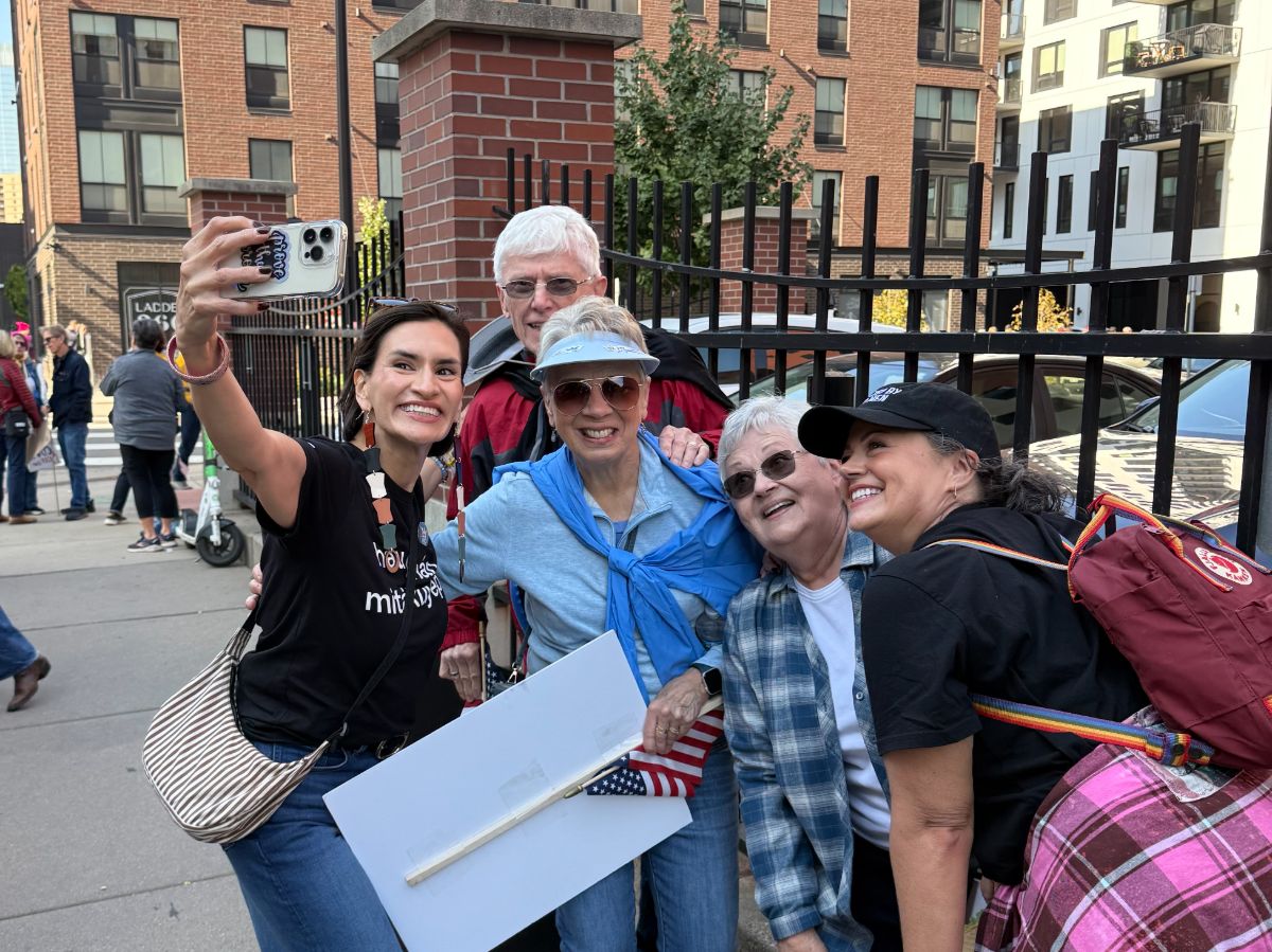 Peggy takes photo with fellow protesters